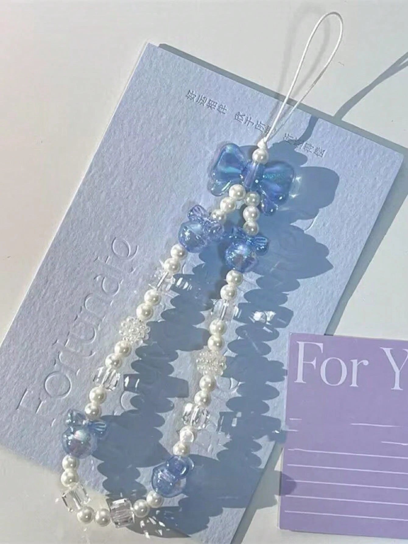 1pc Fashion Minimalist Blue & White Bowknot Faux Pearl Beaded Phone Strap, Suitable As Gift For Any Occasion