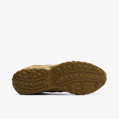 New Balance 204L. Bottom view of quicksand and bark sneaker showing brown outsole with segmented tread pattern.