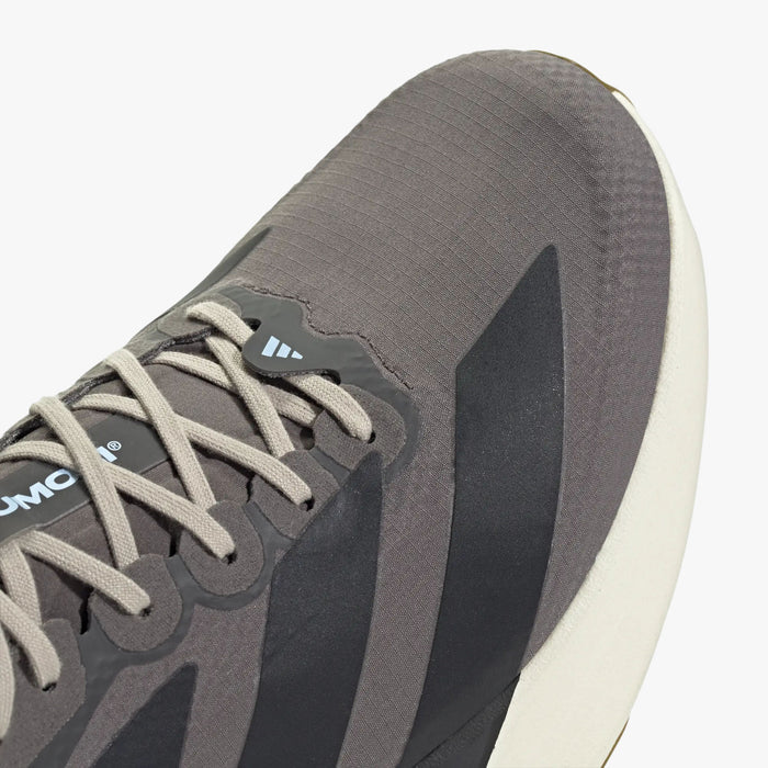 adidas adizero EVO SL. Close-up of Charcoal woven upper showing light grey laces, light blue accent loop, and dark three-stripes.