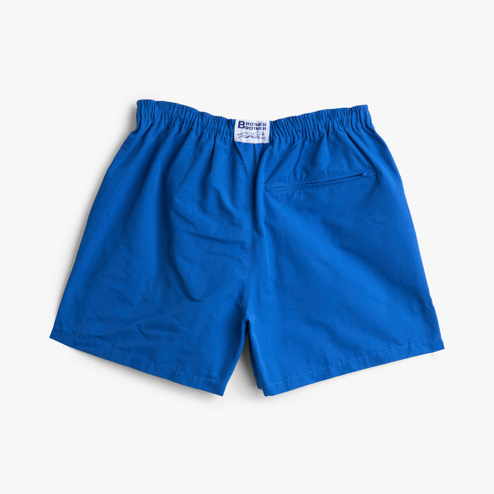 Brother Brother Nylon Baggie. Back view of lapis blue shorts with elastic waistband and rear patch pocket.