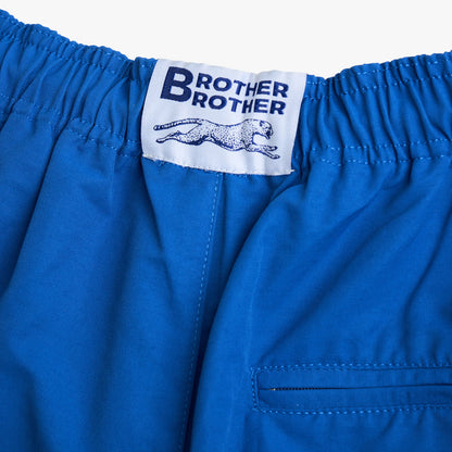 Brother Brother Nylon Baggie. Close-up of lapis blue shorts showing elastic waistband, woven Brother Brother label and rear pocket.