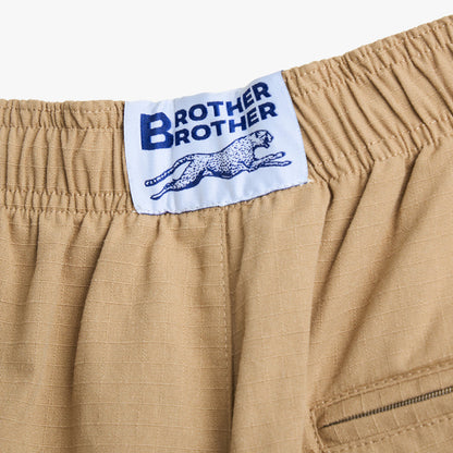 Brother Brother Ripstop Baggie Shorts. Close-up of khaki shorts showing elastic waistband, woven Brother Brother label and rear pocket.