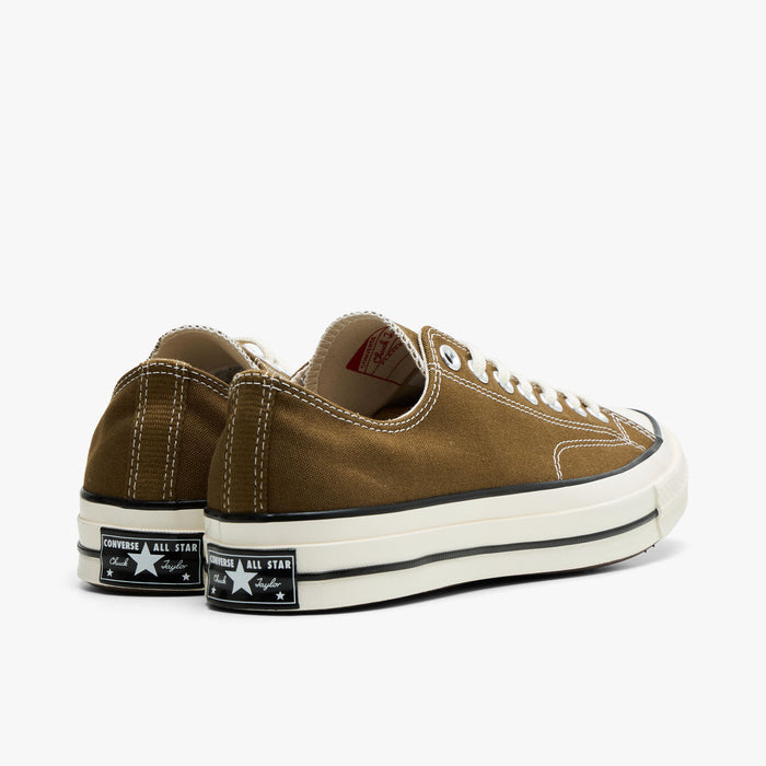 Converse Chuck 70 Canvas. Rear view of bog down canvas sneakers showing black heel logo patch and egret rubber midsole.