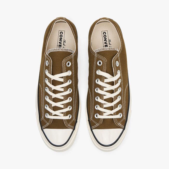 Converse Chuck 70 Canvas. Top view of pair of bog down canvas sneakers showing white laces, textile lining, and inner sole branding.