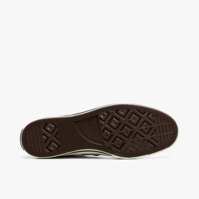 Converse Chuck 70 Canvas. Bottom view of bog down sneakers showing the dark brown rubber traction outsole pattern.