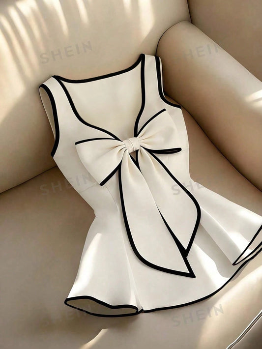 Franclia Women's Elegant Peplum Top,White And Black Contrasting Trim Sleeveless Blouse With Cute Bow,Fitted Waist A-Line Summer Tea Party Ruffle Vest Top