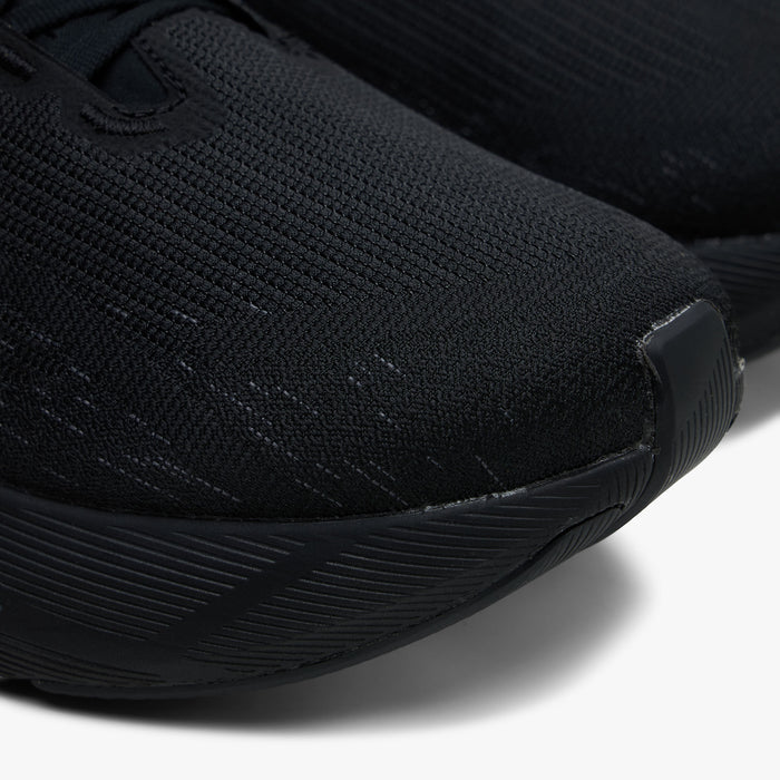 ASICS NOVABLAST 6. Close-up of black running shoe showing mesh toe box, tonal overlays and sculpted forefoot sole.