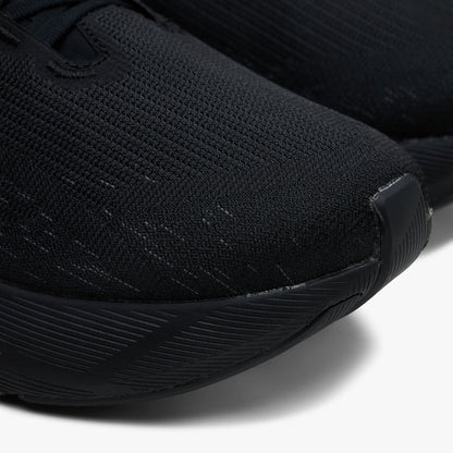 ASICS NOVABLAST 6. Close-up of black running shoe showing mesh toe box, tonal overlays and sculpted forefoot sole.