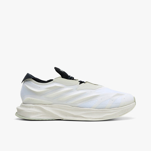 adidas Terra Mono. Side view of white, off white and black sneaker with sculpted upper, black collar and thick layered sole.