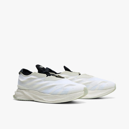 adidas Terra Mono. Three-quarter view of white, off white and black sneakers with black laces, sculpted uppers and thick soles.