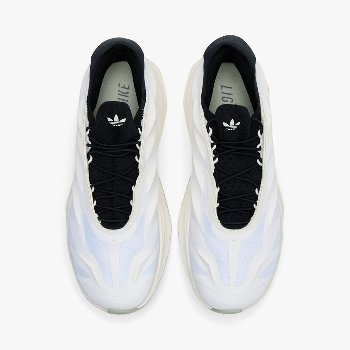 adidas Terra Mono. Top view of white, off white and black sneakers showing black laces, black tongues and white sculpted uppers.