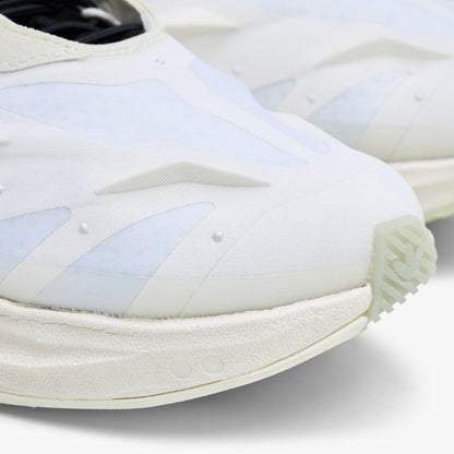adidas Terra Mono. Close-up of white, off white and black sneaker showing layered toe panels and textured off white sole.