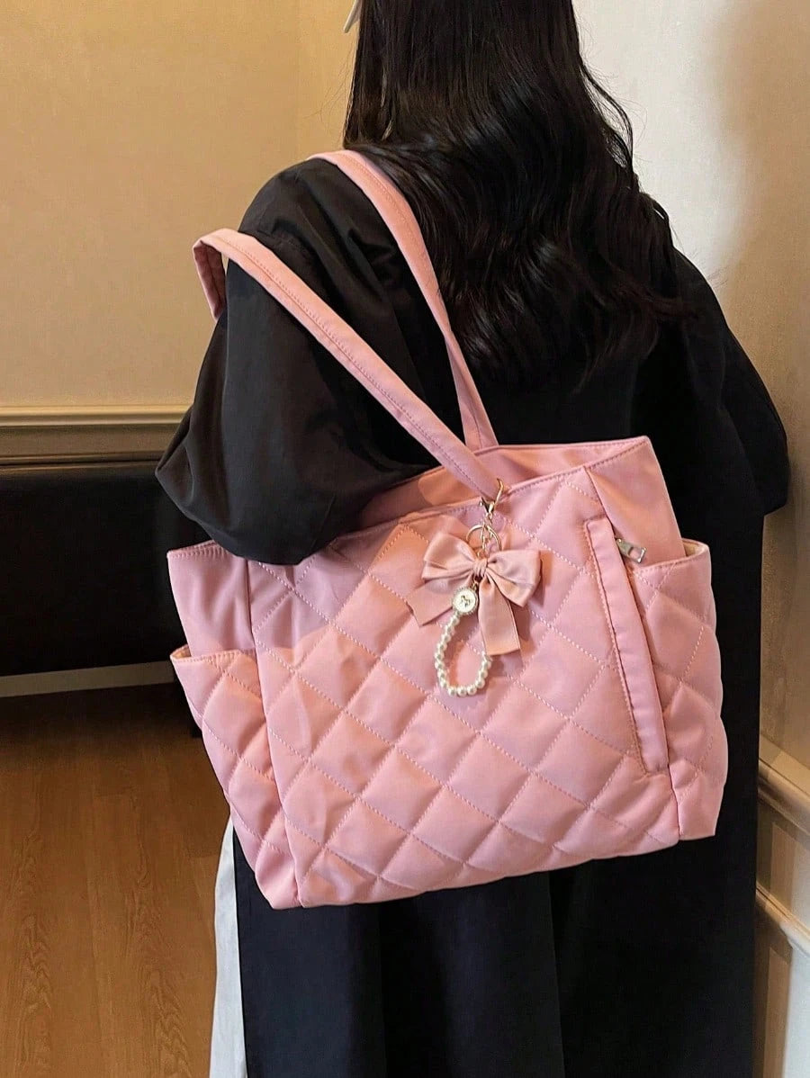 This Brand New Classic Fashionable Large Capacity Solid Color Shoulder Bag Features A Dual-Handle Design, Quilted Craftsmanship, And A Butterfly Faux Pearl Pendant, Making It Lightweight And Easy To C