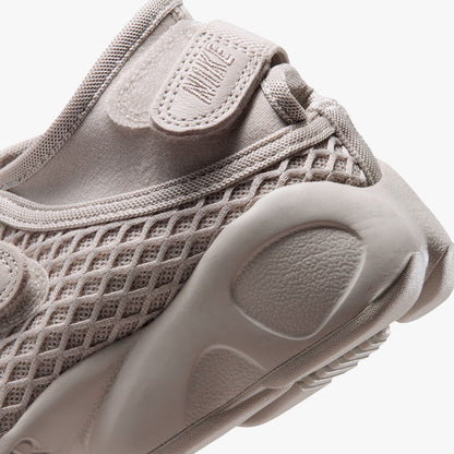 Nike Women's Air Rift. Close-up of Cream II mesh heel panel, adjustable heel strap with Nike embroidery, and chunky cushioned midsole.