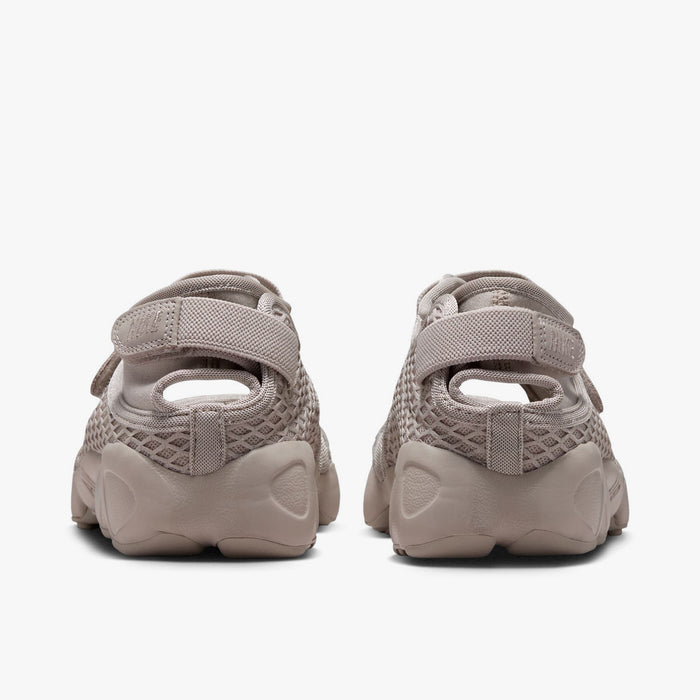Nike Women's Air Rift. Rear view of Cream II split-toe shoes showing adjustable hook-and-loop heel straps and sculpted midsoles.