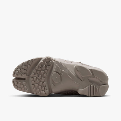 Nike Women's Air Rift. Bottom view of Cream II split-toe shoes showing rubber traction outsole pattern and split-toe groove.