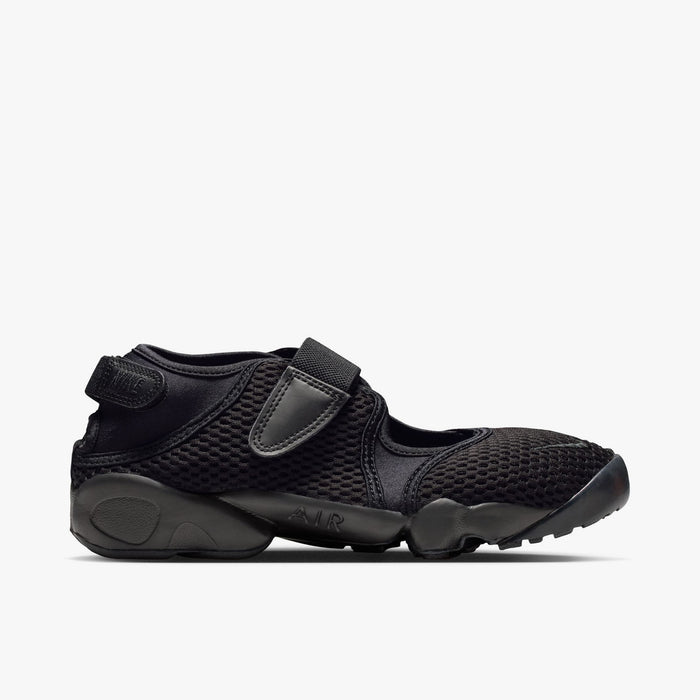Nike Women's Air Rift Mesh. Side view of triple-black split-toe shoes with breathable mesh upper and adjustable midfoot strap.