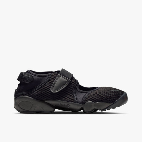 Nike Women's Air Rift Mesh. Side view of triple-black split-toe shoes with breathable mesh upper and adjustable midfoot strap.