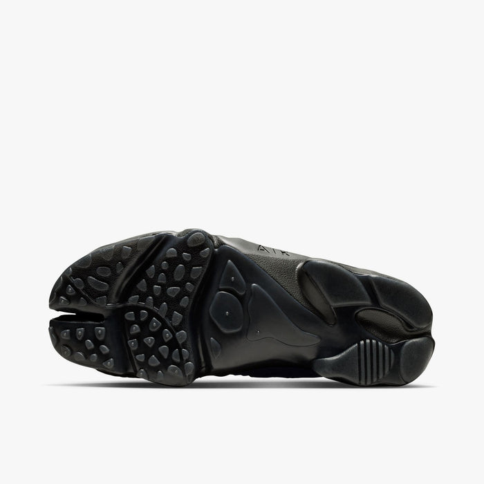 Nike Women's Air Rift Mesh. Bottom view of black split-toe shoes showing rubber traction outsole pattern and split-toe groove.