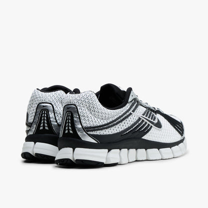 Nike Zoom Skylon 11. Rear view of Summit White and Light Smoke Grey mesh running shoes showing Black heel overlays and white segmented foam midsole.