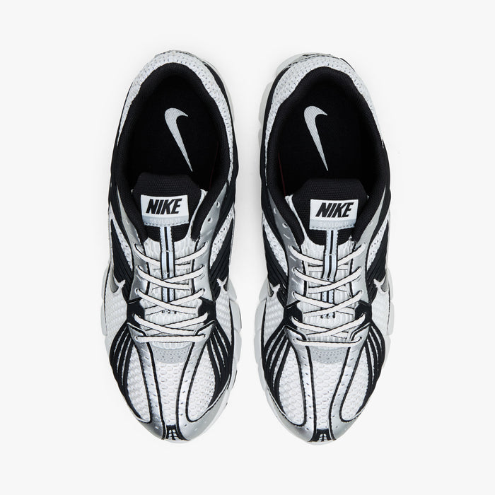 Nike Zoom Skylon 11. Top view of pair of Summit White running shoes showing Black collar lining, textile lining, white laces, and Nike tongue branding.