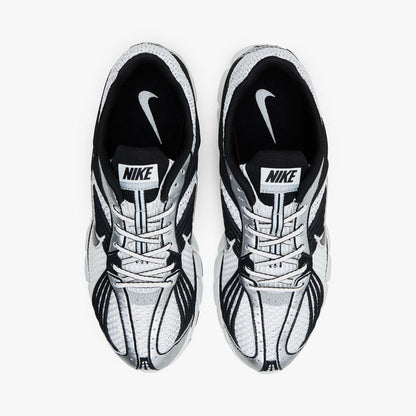 Nike Zoom Skylon 11. Top view of pair of Summit White running shoes showing Black collar lining, textile lining, white laces, and Nike tongue branding.